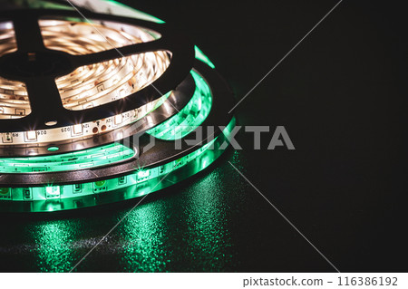 LED strip with green and warm white SMD LEDs, with a black background 116386192