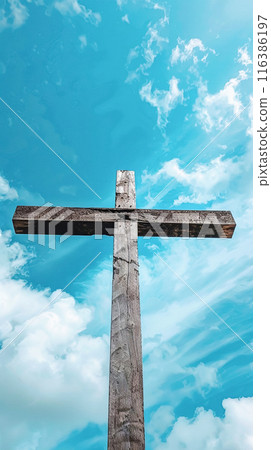 Silhouette of a wooden Christian cross against a blue sky with scattered clouds. Concept of Faith and Spirituality, Easter, Exaltation, religious holidays. Vertical frame Silhouette of a wooden Christian cross against a blue sky with scattered clouds. Concept of Faith and Spirituality, Easter, Exaltation, religious holidays. Vertical frame 116386197