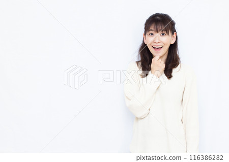 A woman smiling and surprised A woman smiling and surprised 116386282
