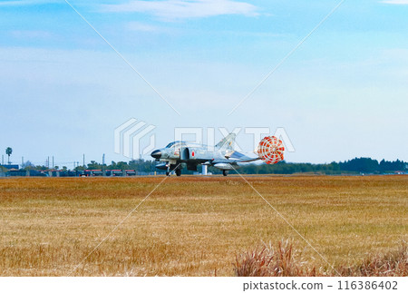 An Air Self-Defense Force F-4EJ Kai fighter jet landing with its drag chute extended An Air Self-Defense Force F-4EJ Kai fighter jet landing with its drag chute extended 116386402