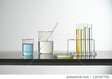 Some laboratory instrument filled by colorful liquid, against on the white background. Photo for advertising pic, was taken from front with blank space for promotional Some laboratory instrument filled by colorful liquid, against on the white background. Photo for advertising pic, was taken from front with blank space for promotional 116387700