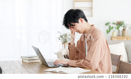 A man who gets sleepy while working A man who gets sleepy while working 116388192