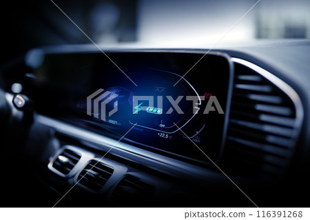 Electric car display screen that is showing the display of electric charging. 116391268