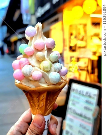 Holding Oiri soft serve ice cream 116391894