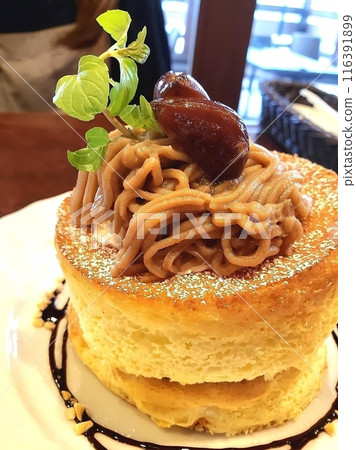 Soufflé pancakes topped with candied chestnuts and Mont Blanc paste Soufflé pancakes topped with candied chestnuts and Mont Blanc paste 116391899