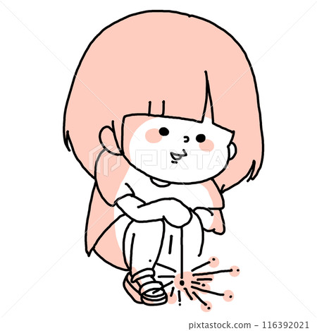 A child squatting and playing with sparklers A child squatting and playing with sparklers 116392021