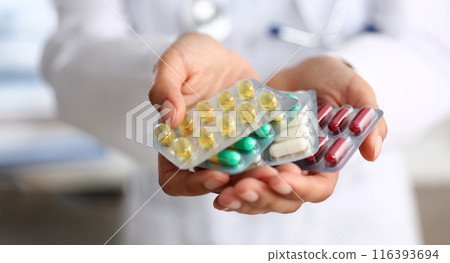 Female doctor hand holding pack of different Female doctor hand holding pack of different 116393694