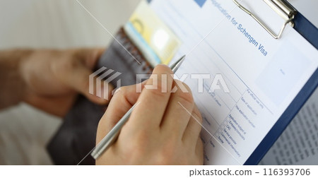 Man filling important documents 116393706
