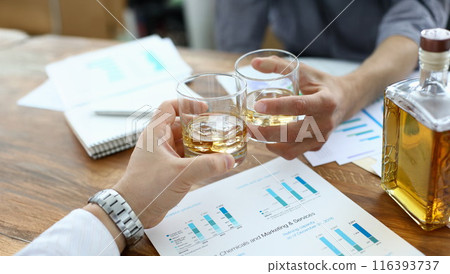 Biz partners drinking in office 116393737