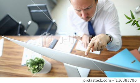 Serious man in office 116393796