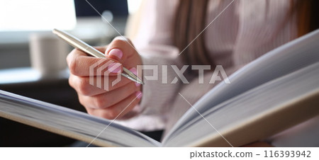 Female clerk arm make marks in notepad Female clerk arm make marks in notepad 116393942