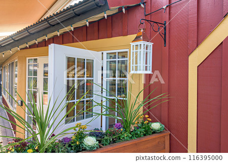 Entrance of a street cafe decorated with flowers Entrance of a street cafe decorated with flowers 116395000