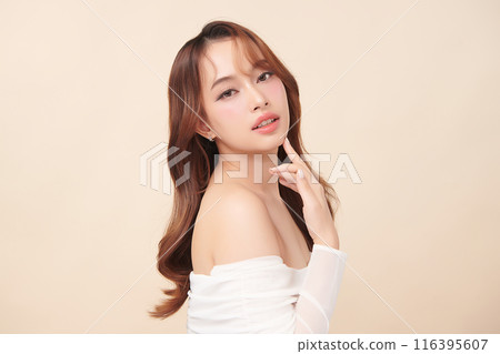 Beautiful young asian woman with clean fresh skin on beige background, Face care, Facial treatment, Cosmetology, beauty and spa, Asian women portrait. 116395607