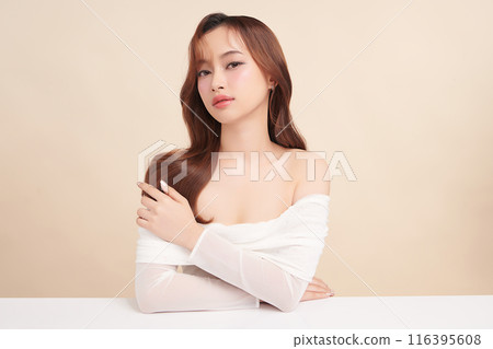 Beautiful young asian woman with clean fresh skin on beige background, Face care, Facial treatment, Cosmetology, beauty and spa, Asian women portrait. 116395608