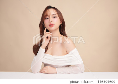 Beautiful young asian woman with clean fresh skin on beige background, Face care, Facial treatment, Cosmetology, beauty and spa, Asian women portrait. 116395609