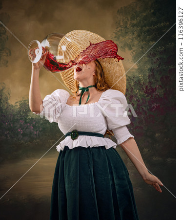 Woman in historical attire, wearing large straw hat, white blouse, and green skirt, enthusiastically drinks from giant wine glass, with red wine spill over her face Woman in historical attire, wearing large straw hat, white blouse, and green skirt, enthusiastically drinks from giant wine glass, with red wine spill over her face 116396127