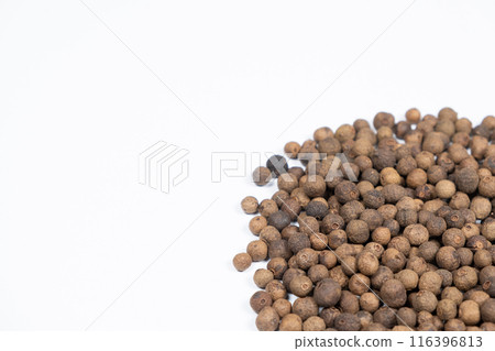 Black peppercorns close-up on white background, copy space for text 116396813
