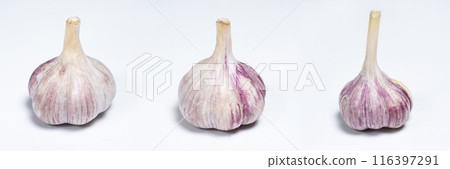 Three unpeeled fresh bulbs of garlic on a white isolate background 116397291