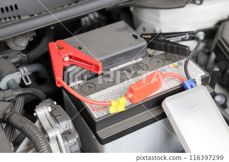 Restart your dead car battery with a mobile battery 116397299