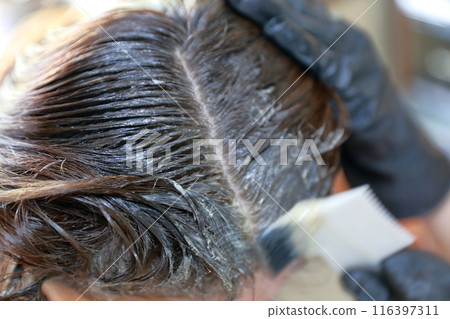 A woman with white hair dye A woman with white hair dye 116397311