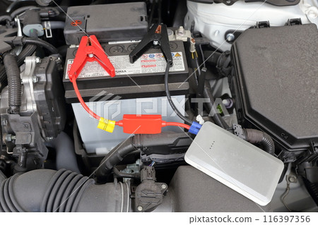 Restart your dead car battery with a mobile battery Restart your dead car battery with a mobile battery 116397356