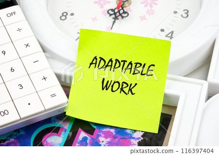 Business ADAPTABLE WORK concept. Copy space. Concept words ADAPTABLE WORK on a light green sticker on the background of a clock near the calculator Business ADAPTABLE WORK concept. Copy space. Concept words ADAPTABLE WORK on a light green sticker on the background of a clock near the calculator 116397404