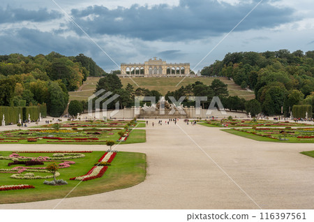 Vienna, Austria, August 20, 2022. In the gardens of Schonbrunn Palace, the historic greenhouse stands out for its characteristic design. Travel destinations. Copy space 116397561