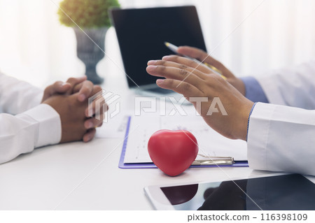 Doctor explaining heart to patient about details and risks operation. Healthcare and medical concept. Physician explaining health exam to patient. Doctor explaining heart to patient about details and risks operation. Healthcare and medical concept. Physician explaining health exam to patient. 116398109
