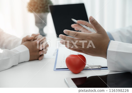 Doctor explaining heart to patient about details and risks operation. Healthcare and medical concept. Physician explaining health exam to patient. Doctor explaining heart to patient about details and risks operation. Healthcare and medical concept. Physician explaining health exam to patient. 116398226