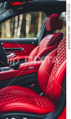 The red quilted leather of this luxury car's interior is a statement of unmatched style and sophistication for the discerning driver. The red quilted leather of this luxury car's interior is a statement of unmatched style and sophistication for the discerning driver. 116398728