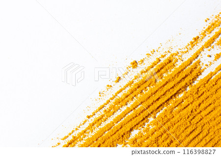Abstract striped orange background of spilled turmeric on white background. Abstract striped orange background of spilled turmeric on white background. 116398827