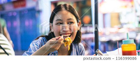 Web Banner of Young Asian woman traveler tourist eating Thai street food in China town night market in Bangkok in Thailand - people traveling enjoying food culture concept Web Banner of Young Asian woman traveler tourist eating Thai street food in China town night market in Bangkok in Thailand - people traveling enjoying food culture concept 116399086