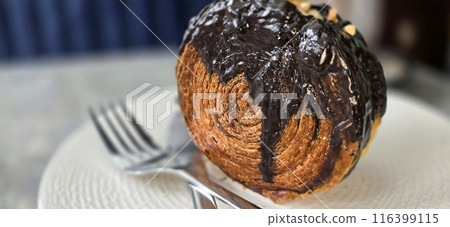 Delicious Cromboloni or Crombolini, croissant Bomboloni round New York Roll with Chocolate or caramel sauce pastry perfect for dessert recipe multimedia content 116399115