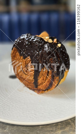 Delicious Cromboloni or Crombolini, croissant Bomboloni round New York Roll with Chocolate or caramel sauce pastry perfect for dessert recipe multimedia content Delicious Cromboloni or Crombolini, croissant Bomboloni round New York Roll with Chocolate or caramel sauce pastry perfect for dessert recipe multimedia content 116399162