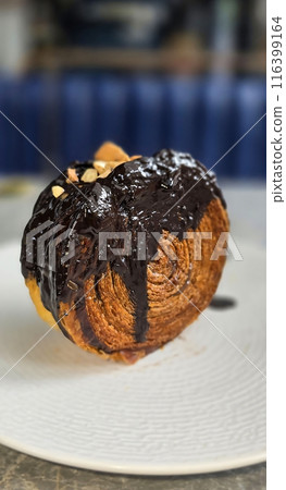 Delicious Cromboloni or Crombolini, croissant Bomboloni round New York Roll with Chocolate or caramel sauce pastry perfect for dessert recipe multimedia content Delicious Cromboloni or Crombolini, croissant Bomboloni round New York Roll with Chocolate or caramel sauce pastry perfect for dessert recipe multimedia content 116399164