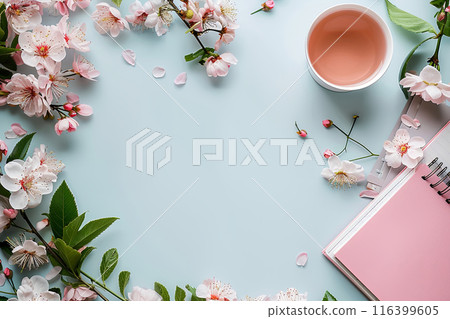 Top view blue background with pink flowers and notebook with copy space Top view blue background with pink flowers and notebook with copy space 116399605