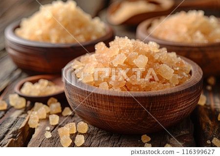 Wooden bowls filled with granulated cane sugar Wooden bowls filled with granulated cane sugar 116399627