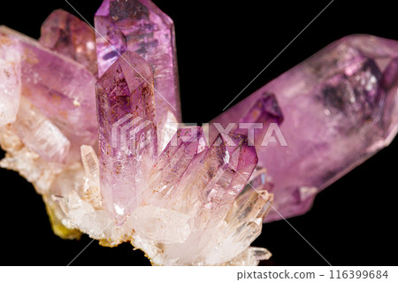 Macro of amethyst mineral stone on black background 116399684