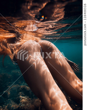 Perfect body of slim woman with red hairs underwater in sea, girl swimming Perfect body of slim woman with red hairs underwater in sea, girl swimming 116400316