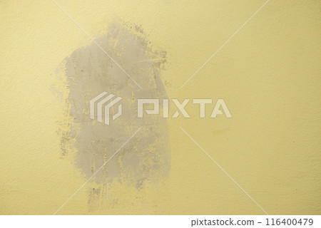Plastered with gypsum hole in the yellow wall Plastered with gypsum hole in the yellow wall 116400479
