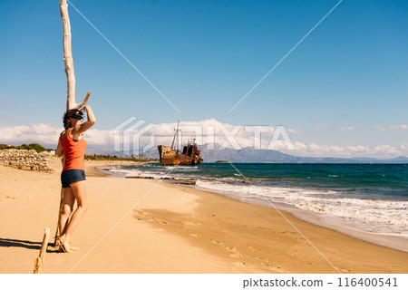 Tourist woman on beach enjoying vacation 116400541