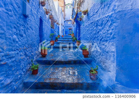 The narrow alley with stairs is very attractive to tourists. Morocco. The narrow alley with stairs is very attractive to tourists. Morocco. 116400906