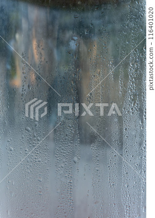 Closeup shot of a steamy window with water drops 116401020