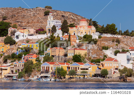 Multi-colored facades of houses in the Greek village Symi on a sunny day Multi-colored facades of houses in the Greek village Symi on a sunny day 116401028