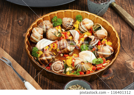 Edible stuffed snails, delicatessen food. Edible stuffed snails, delicatessen food. 116401312