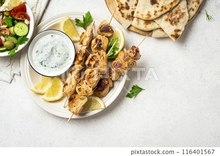 Chicken skewers and greek tzatziki sauce 116401567