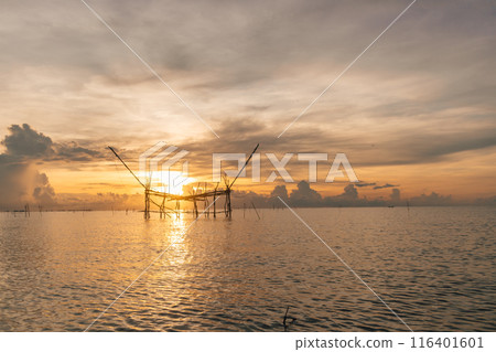 Morning scene of village fish net in Songkhla lake, Phatthalung, Thailand. Morning scene of village fish net in Songkhla lake, Phatthalung, Thailand. 116401601