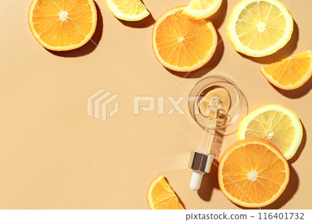 Beauty serum dropper with fruit acids and vitamin C and citrus slices Beauty serum dropper with fruit acids and vitamin C and citrus slices 116401732