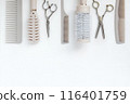 Hairdressing combs in light beige color scissors on white background. Text frame hair salon template with copy space 116401759
