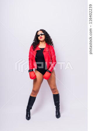 African oversize woman with boxing gloves on studio background, beautiful dark-skinned female boxer 116402239
